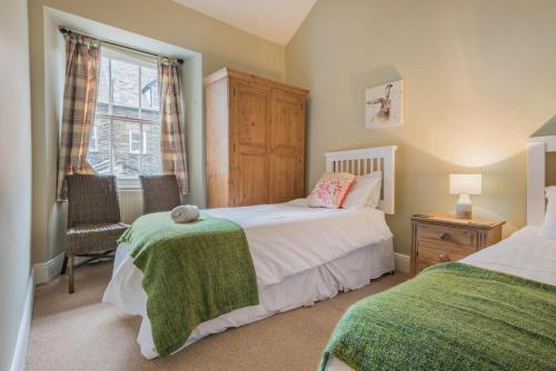 Postel nebo postele na pokoji v ubytování Rowan Cottage