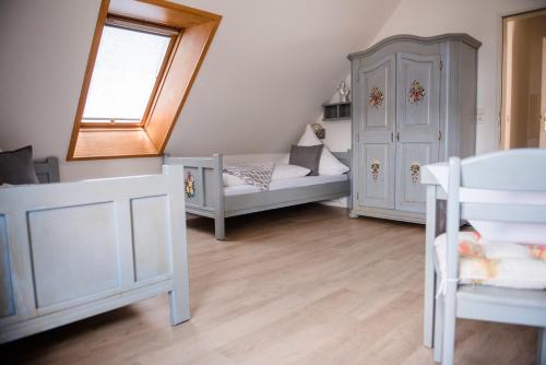 Ein Bett oder Betten in einem Zimmer der Unterkunft Allmanns-Kroog