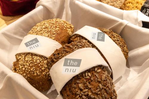 a basket of bread with the nuts on them at Holiday Inn - the niu, Leo Nuremberg by IHG in Nürnberg