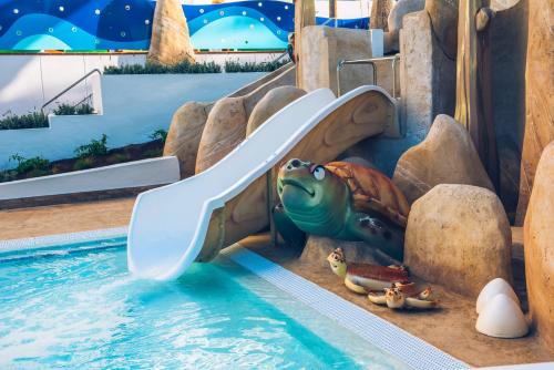 a slide in a pool at a water park at Iberostar Waves Bouganville Playa in Adeje