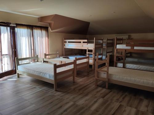 a dorm room with four bunk beds in it at Luna in Prokuplje