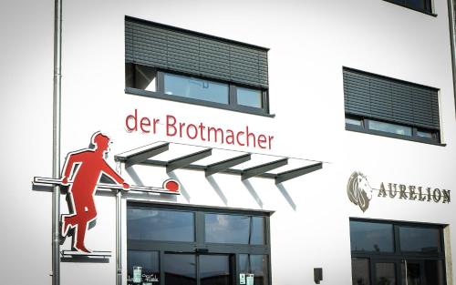 a sign on the side of a building at Prime Park Apartment Aschaffenburg in Aschaffenburg