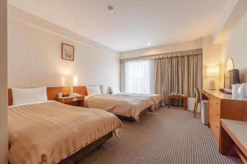 Postel nebo postele na pokoji v ubytování Hotel Gimmond Kyoto