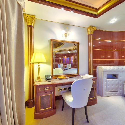 a bedroom with a desk and a mirror at Mulino Luxury Boutique Hotel in Buje