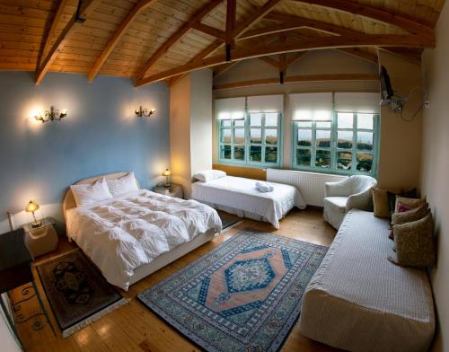 a bedroom with a bed and a living room at Casa Mare in Nimfaíon