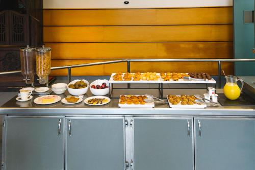 a buffet with different types of food on a table at Olarain in Donostia-San Sebastián