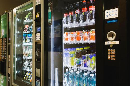 a vending machine filled with lots of bottles of soda at Olarain in Donostia-San Sebastián
