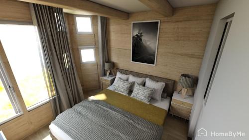 a bedroom with a bed and a couch in a room at White Paradise in Val dʼIsère