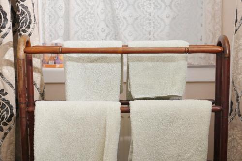a towel rack with towels on it in a bathroom at The Dunning Hotel in Perth
