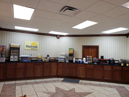 a waiting room with a payment counter in a restaurant at Days Inn by Wyndham Columbus-North Fort Moore in Columbus