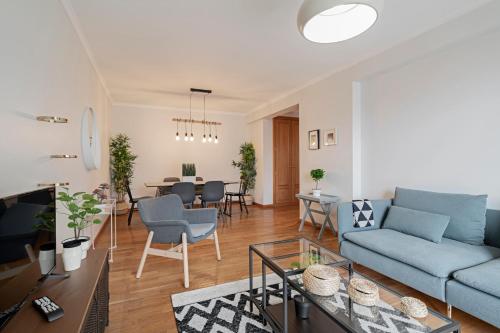 a living room with a couch and a table at Ilhéus IV by An Island Apart in Funchal