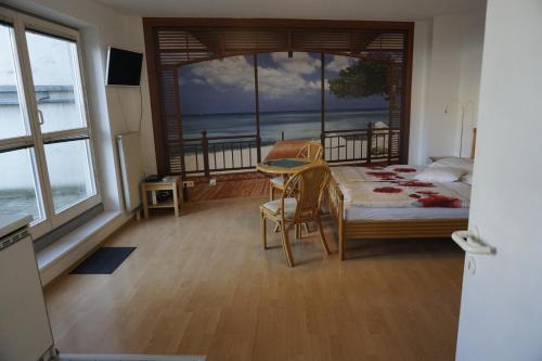 a bedroom with a bed and a view of the ocean at Terrassentraum in Vienna