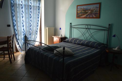 Ένα ή περισσότερα κρεβάτια σε δωμάτιο στο Tra... Monti E Vigne