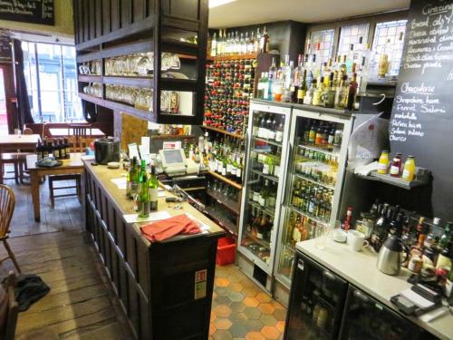a bar in a restaurant with a lot of alcohol at 8 Opera Suites, Llangollen in Llangollen