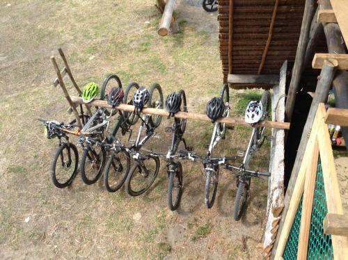 a bunch of bikes are hanging on a rack at Mutiara Beach Resort in Berakit