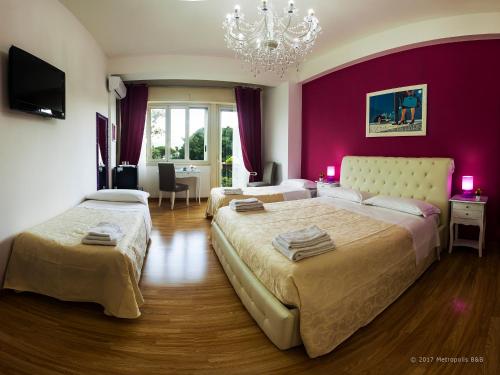 Postel nebo postele na pokoji v ubytování Metropolis B&B