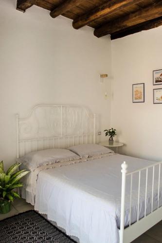Postel nebo postele na pokoji v ubytování Domu 'e Casteddu