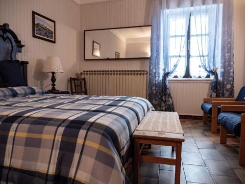 Ένα ή περισσότερα κρεβάτια σε δωμάτιο στο I Quattro Grappoli