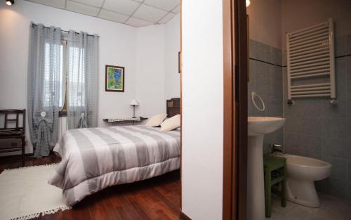 Ένα ή περισσότερα κρεβάτια σε δωμάτιο στο I Quattro Grappoli