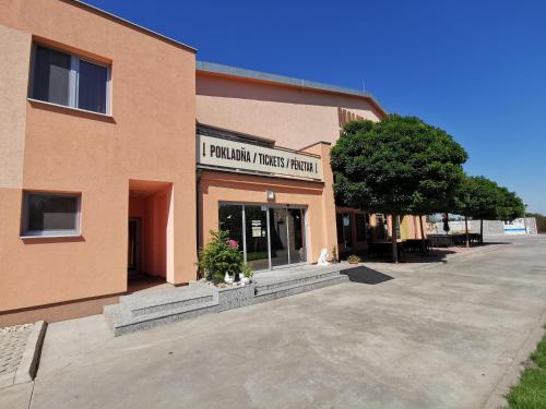 a building with a sign that reads i pumpkin research research at Malkia Penzion in Orechová Potôň