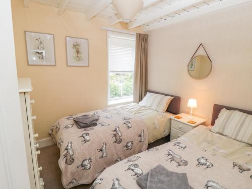 Katil atau katil-katil dalam bilik di Pheasant Cottage