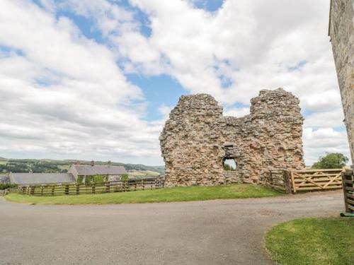 an old stone building on the side of a road at The Steadings in Morpeth