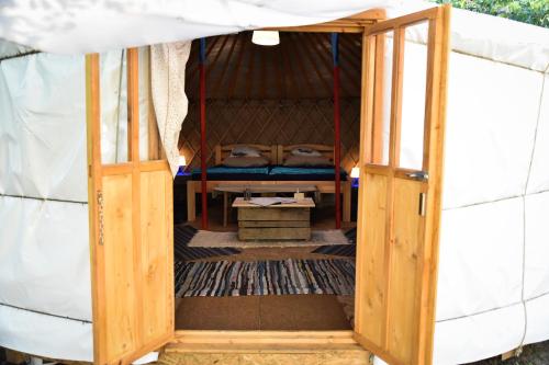 an open door of a yurt with a bed at Alföldi Jurta Ruzsa in Ruzsa