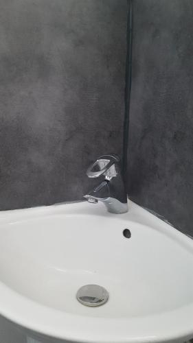 a close up of a white toilet in a room at Duplex à 5 min aéroport Orly - 15 min Paris in Athis-Mons