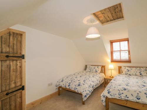 a bedroom with two beds and a window at 11 Village in Banff