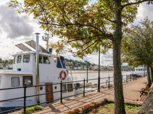 a boat is docked at a dock at The Shippon in Barnstaple