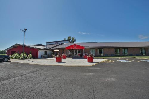 a parking lot in front of a store at King Hotel in Palmerston