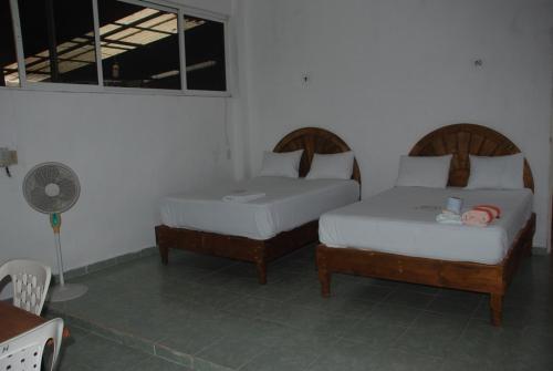 Cama o camas de una habitación en Hospedaje Papagrande