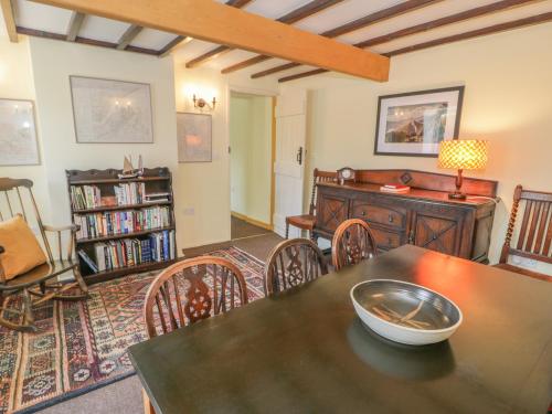 a living room with a table and chairs at Ael Y Bryn in Menai Bridge