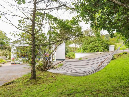 a hammock in a yard in front of a house at The Mermaid in Dungloe