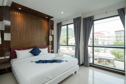 Postel nebo postele na pokoji v ubytování Baan Thai Beach Side Residence