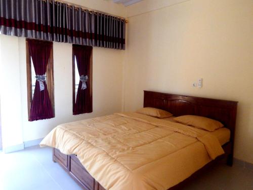Ένα ή περισσότερα κρεβάτια σε δωμάτιο στο Golo Tango Homestay