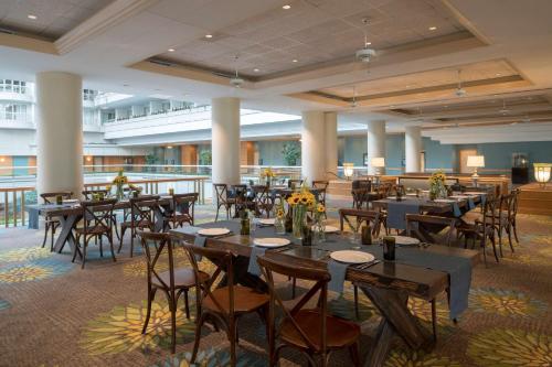 a banquet hall with tables and chairs in a building at Hyatt Regency Orlando International Airport Hotel in Orlando