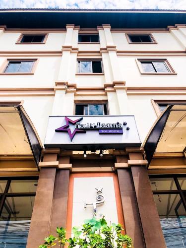 a hotel sign on the front of a building at Top Hostel (Top Mansion) in Udon Thani