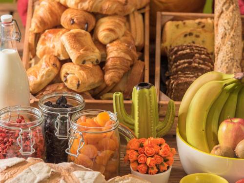 a table with a crate of bread and other foods at Ibis Styles Liverpool Centre Dale Street - Cavern Quarter in Liverpool