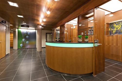 a lobby with a bar in a building at Rokua Health & Spa in Rokua