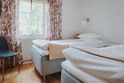 Säng eller sängar i ett rum på Balingsholm
