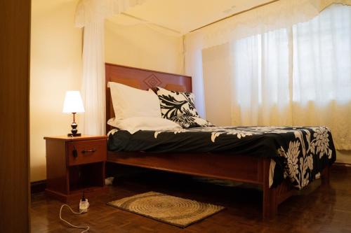 Säng eller sängar i ett rum på Wakawaka House