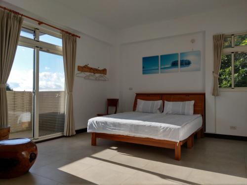 Postel nebo postele na pokoji v ubytování Shan Hu Lian Homestay