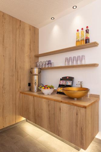 a kitchen with a counter with a bowl on it at Hotel Hubertus in Sölden