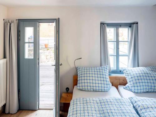 a bedroom with two beds and a window at Schlosserhaus Lam in Lam