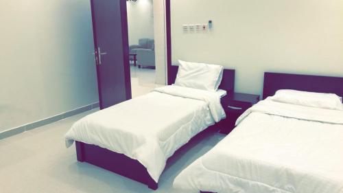 Postel nebo postele na pokoji v ubytování Al Taif Villas