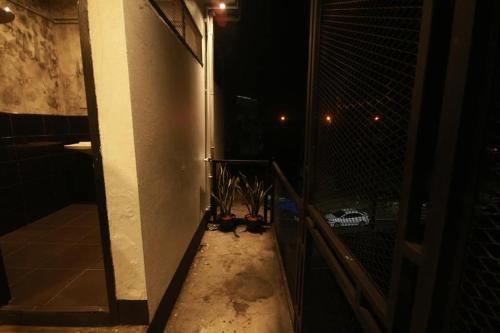 a room with a wall with a bunch of wires at Backpack Hostel in Chiang Rai