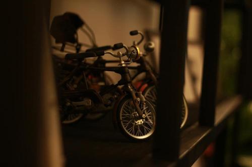 a bike sitting on a shelf in a room at Backpack Hostel in Chiang Rai