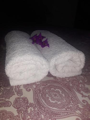 a white towel animal laying on a table at El Atico de Villalmar in Tui