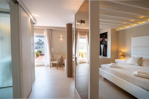 a bedroom with a bed and a view of a room at Covo dei Saraceni in Polignano a Mare